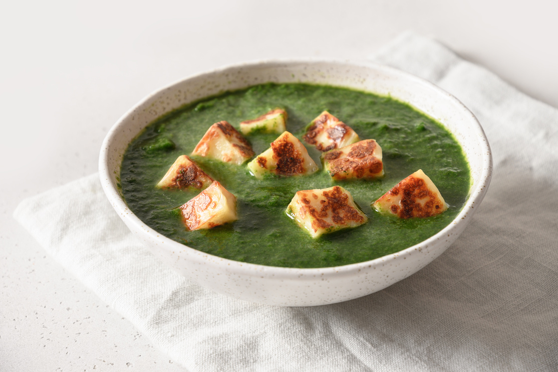 Palak Paneer Served Basmati Rice on White.