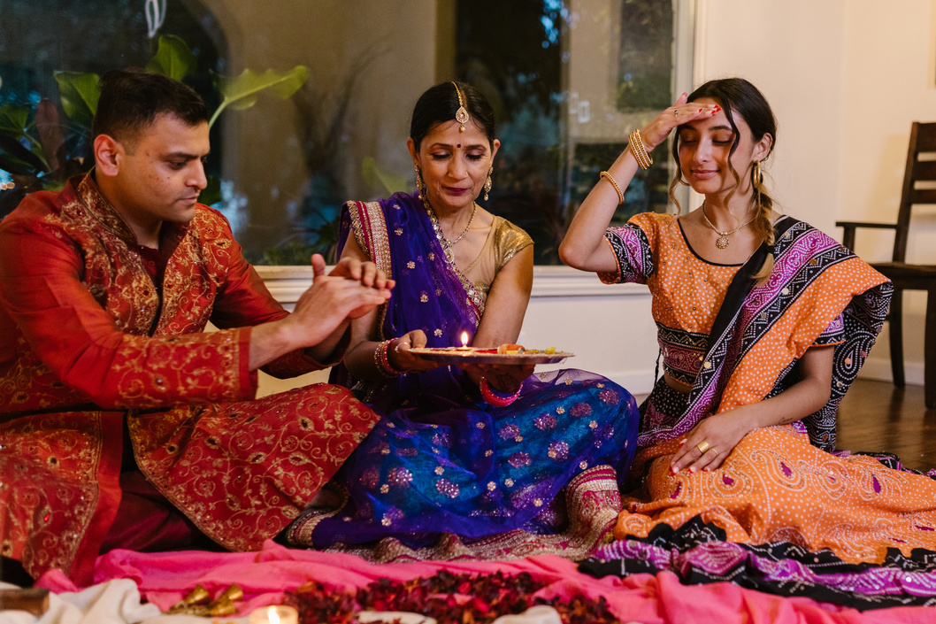 Three People in Traditional Clothing